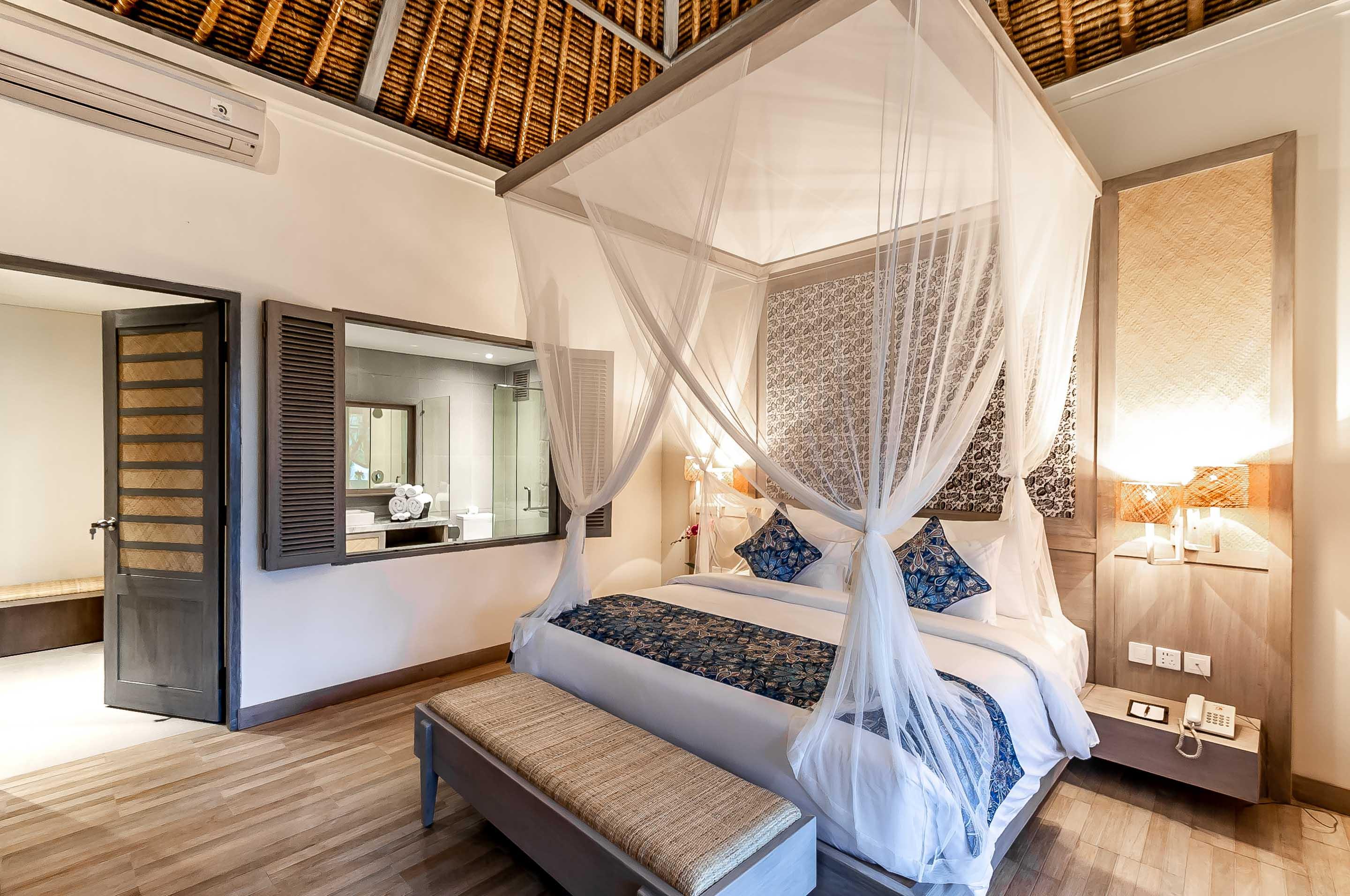 Nirwana Beach & Resort Candidasa Esterno foto A bedroom at the resort